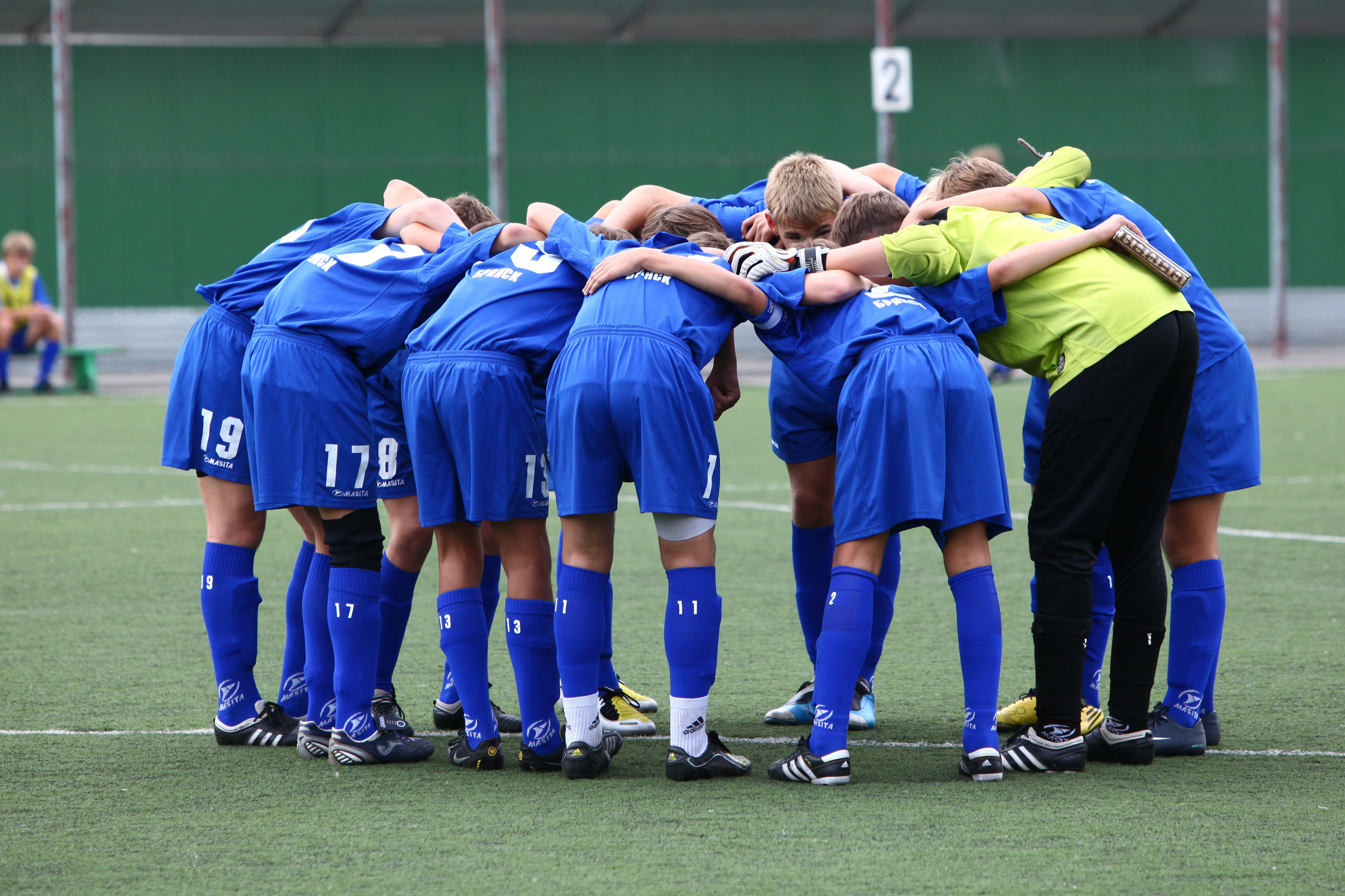 Huddling in a youth soccer match